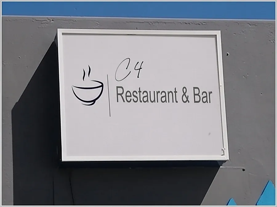 The C4 Restaurant & Bar sign on the corner